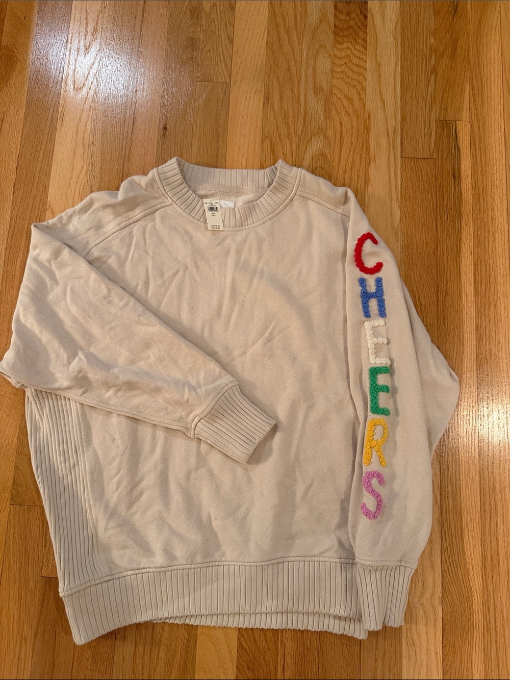NET Aerie Cream Crewneck Sweatshirt with Colorful 'CHEERS' Sleeve